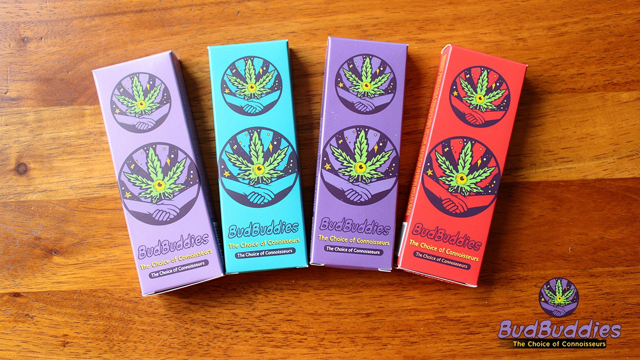 Five cartoon rolling paper packs arranged on wooden surface